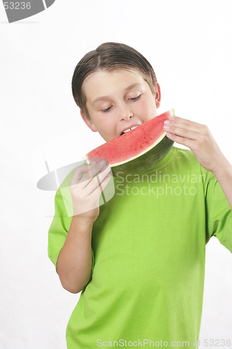 Image of Boy eating a piece of watermelon