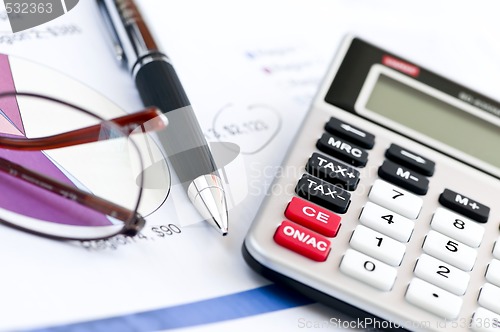 Image of Tax calculator pen and glasses
