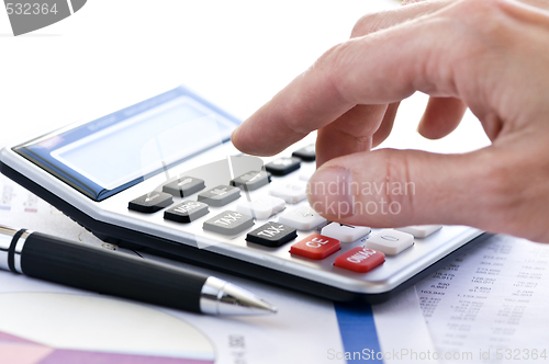 Image of Tax calculator and pen