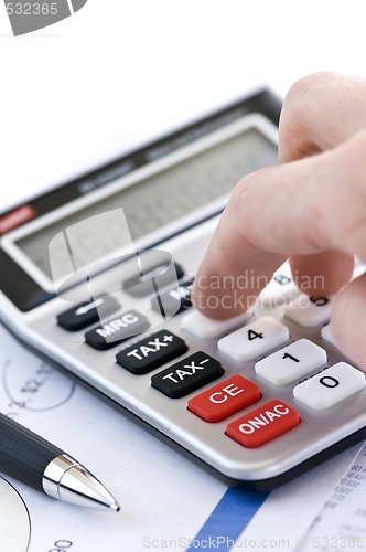 Image of Tax calculator and pen