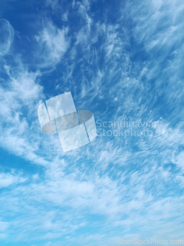 Image of Clusters of high-altitude cirrus cumulus clouds in April