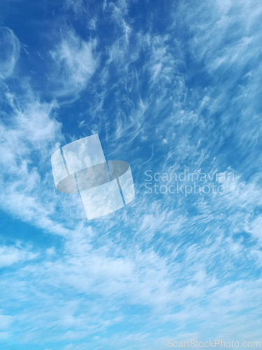 Image of Clusters of high-altitude cirrus cumulus clouds in April