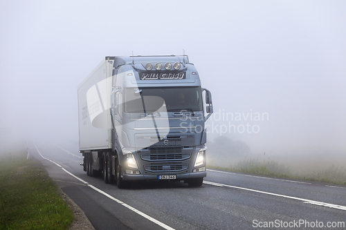 Image of Volvo FH Truck Semi Trailer Emerging from Fog