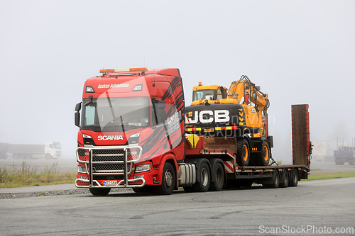 Image of Scania Truck Ready To Transport Wheeled Excavator