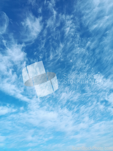 Image of Clusters of high-altitude cirrus cumulus clouds in April