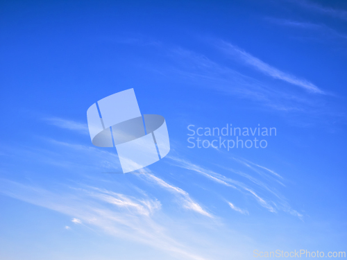Image of White clouds on bright blue sky, high stratospheric light white 