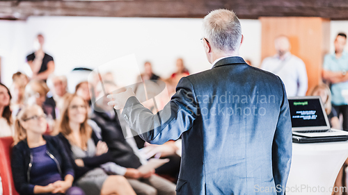 Image of Speaker at Business Conference and Presentation.