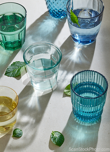 Image of various colorful water glasses