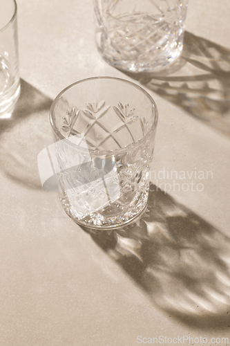 Image of empty glasses on beige background