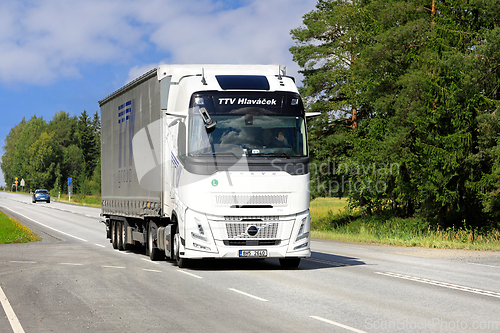 Image of White Volvo FH Aero Truck Semi Trailer on Road
