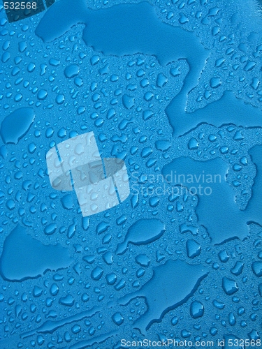 Image of Water drops over blue plastic material