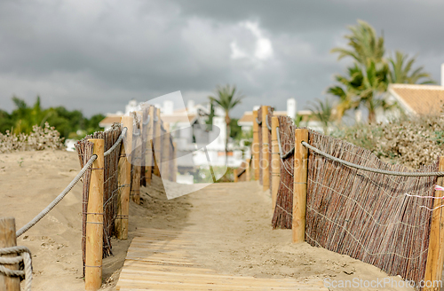 Image of backyard gate to Marbella beach