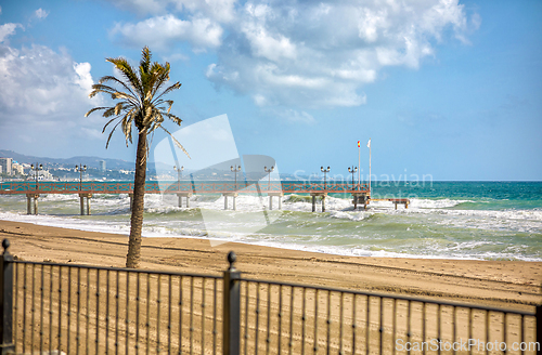 Image of wooden pier on the Costa del Sol in Marbella, Spain