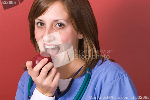 Image of Nurse Biting An Apple