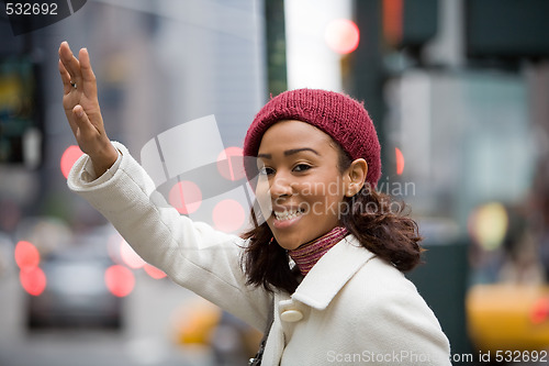 Image of Woman Hailing A Cab