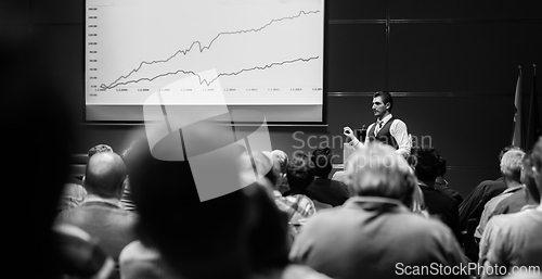 Image of Speaker giving presentation on business conference event.