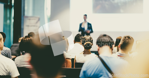 Image of Male business speaker giving a talk at business conference event.