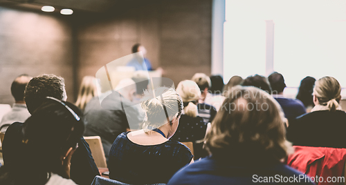Image of Speaker giving presentation on health care conference.