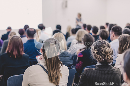 Image of Woman giving presentation on business conference.