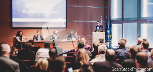 Image of Speaker giving presentation on scientific business conference.