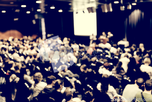 Image of Speaker giving presentation on scientific business conference.