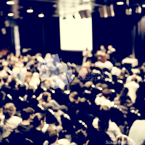 Image of Speaker giving presentation on scientific business conference.