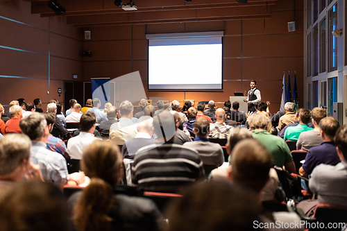Image of Business speaker giving a talk at business conference meeting event.