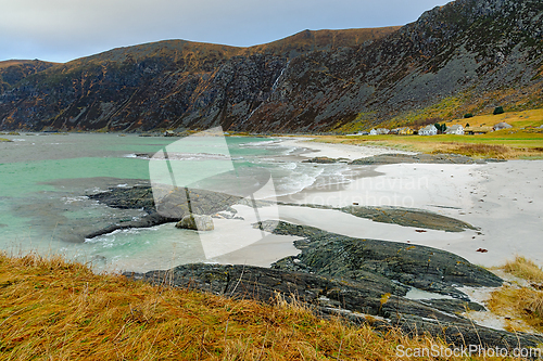 Image of Coastal landscape at a remote beach with rocky shoreline and tur