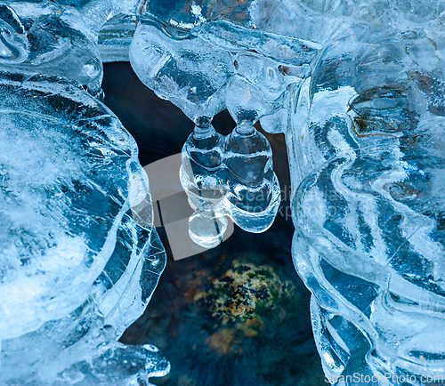 Image of Intricate patterns of glacial ice formations sparkling under nat