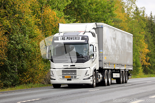 Image of Gas Powered Volvo FM 460 LBG Semi Truck on Road