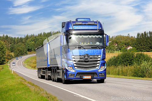 Image of Blue Mercedes-Benz Actros Transporter on Road