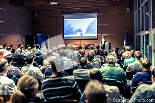 Image of Business speaker giving a talk at business conference meeting event.