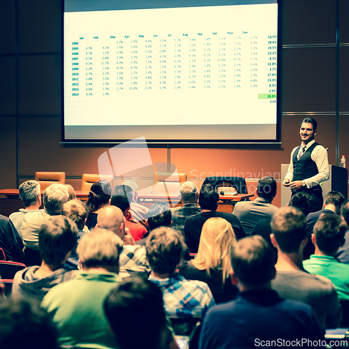Image of Business speaker giving a talk at business conference meeting event.