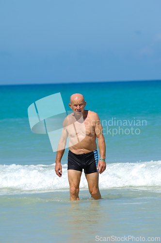Image of Senior man in water