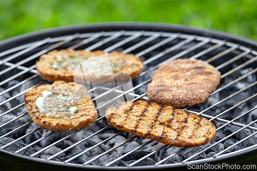 Image of bread buns on grill