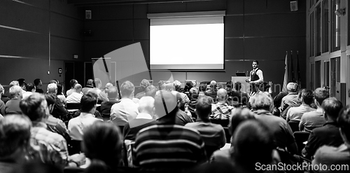 Image of Business speaker giving a talk at business conference meeting event.