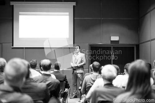 Image of Business speaker giving a talk at business conference meeting event.