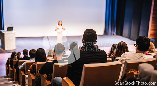 Image of Woman giving presentation on business conference event.
