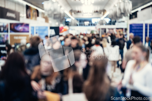 Image of Abstract blurred people at exhibition hall of expo event trade show. Business convention show or job fair. Business concept background.