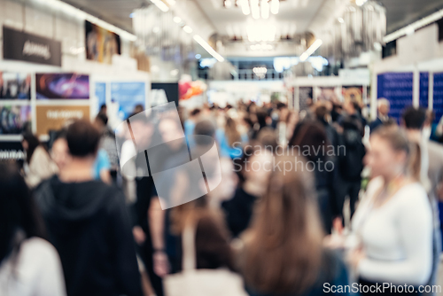 Image of Abstract blurred people at exhibition hall of expo event trade show. Business convention show or job fair. Business concept background.