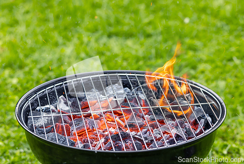 Image of burning charcoal grill