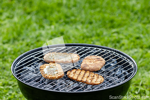 Image of bread buns on grill