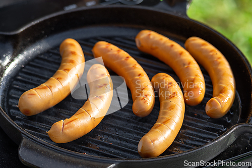 Image of sausages on grill pan