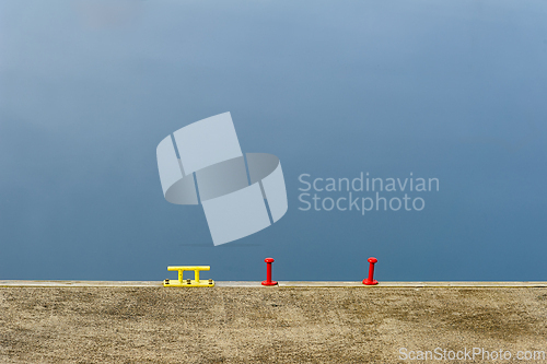Image of A minimalist composition featuring vibrant yellow and red object