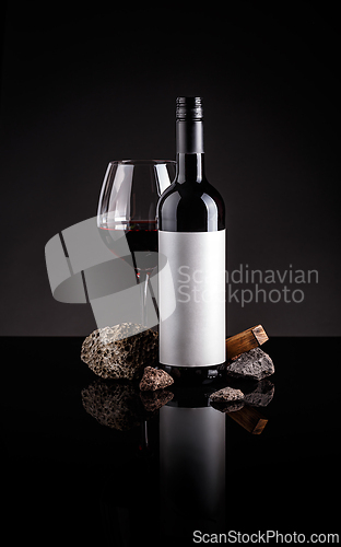 Image of Bottle and glass of red wine