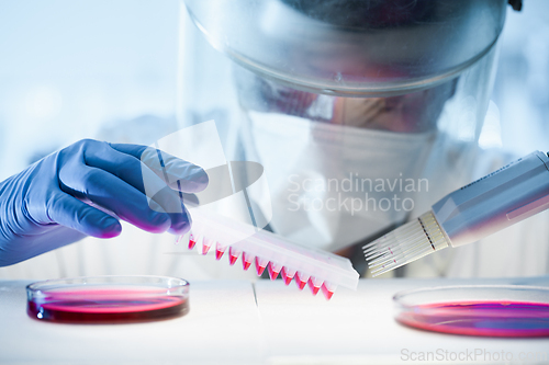 Image of Scientist working in the corona virus vaccine development laboratory research with a highest degree of protection gear.