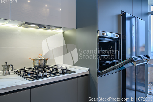 Image of Luxury modern kitchen interior, oven\'s door opened