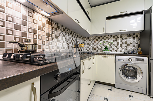 Image of Brown and white modern kitchen interior