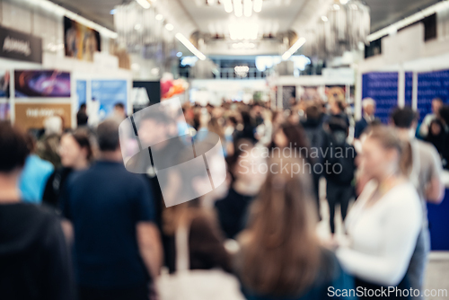 Image of Abstract blurred people at exhibition hall of expo event trade show. Business convention show or job fair. Business concept background.