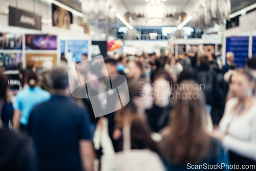Image of Abstract blurred people at exhibition hall of expo event trade show. Business convention show or job fair. Business concept background.